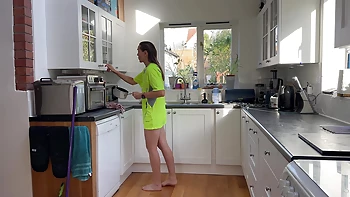 After a hot and sweaty run, she thew off her underwear, but kept her T-shirt on. Doing some house work, cleaning up and a kitchen tidy, she bends over, scratches her ass and everything is revealed. Her ass on full display as this cheeky housewife goes abo